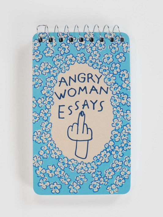The Blue Q Angry Woman Essays 3x5 Spiral Notebook features a blue floral cover with a hand-drawn middle finger—an ideal sarcastic gift or funny desk accessory for women.