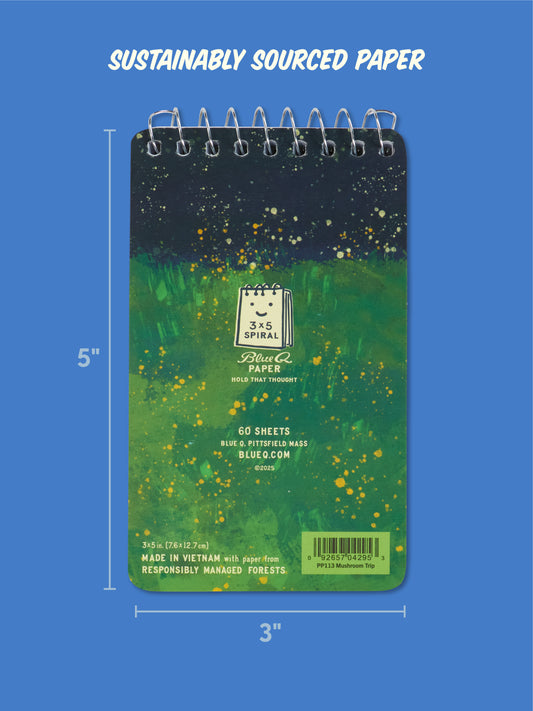 The Blue Q "Notes From My Mushroom Trip" 3x5 Spiral Notebook features a vibrant green and yellow nature-themed cover and sustainable paper—ideal for capturing thoughts on the go. Shown on a blue background.