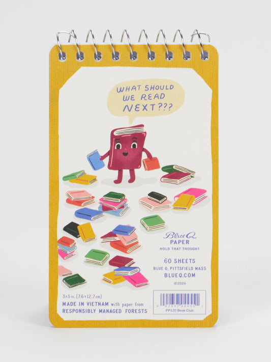 The Blue Q Book Club 3x5 Spiral Notebook features a cartoon book on the cover asking, “What should we read next?” and is surrounded by brightly illustrated books—perfect for jotting down book club discussion notes as you sip wine. This small spiral notebook contains 60 sheets made from paper sourced from responsibly managed forests.