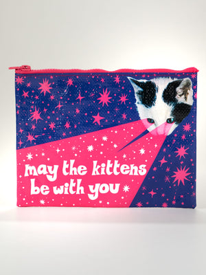 The Blue Q "May The Kittens Be With You" Zipper Pouch features a cat’s face with pink rays from its eyes, stars around it, and playful white text: “may the kittens be with you—and also with you.”.