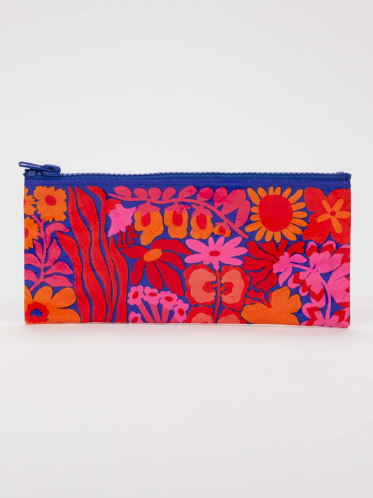 The Bright Blooms Pencil Case by Blue Q features a vibrant floral pattern in shades of red, pink, and orange, accented by a blue zipper on top. Crafted from recycled material, this zippered pouch’s bold colors truly stand out against its plain white background.