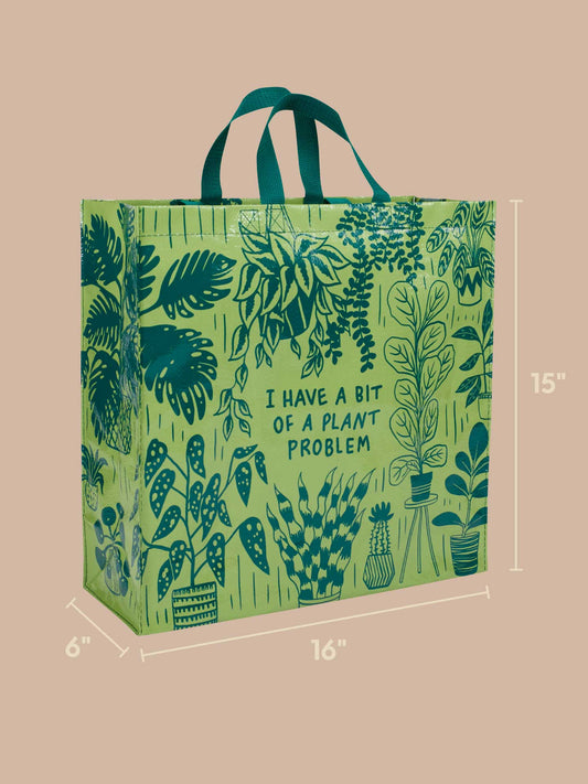 Carry your love for greenery with the Blue Q "I Have A Bit Of A Plant Problem Shopper." This green reusable tote bag features leafy plant illustrations, sturdy green handles, and the quirky text “I HAVE A BIT OF A PLANT PROBLEM.” Ideal for fellow plant lovers, it measures 16" wide, 15" tall, and 6" deep.