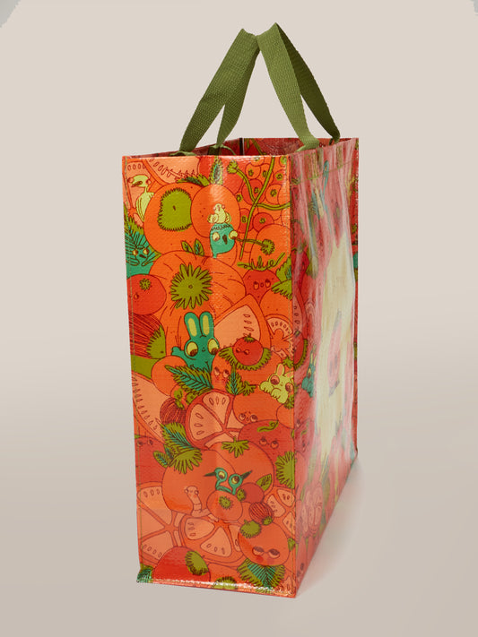 Add charm to your errands with the Blue Q "I'm Living For Tomato Season Shopper"—a colorful tote featuring green handles and vibrant cartoon veggies. Made from recycled materials, it's the perfect eco-friendly accessory for tomato season.