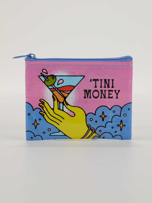 The Blue Q Tini Money Coin Purse is a colorful zippered pouch featuring a hand holding a martini glass with a fly inside and "TINI MONEY" text, set on a pink and blue starry background—perfect for premium spirits fans.