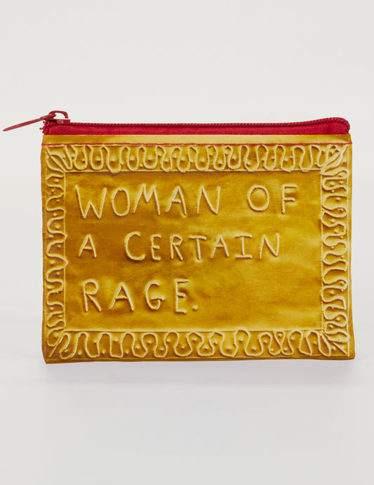 The Blue Q Woman Of A Certain Rage Coin Purse is a yellow pouch with a red zipper, made from eco-friendly recycled material and embossed with "WOMAN OF A CERTAIN RAGE" in a decorative border.