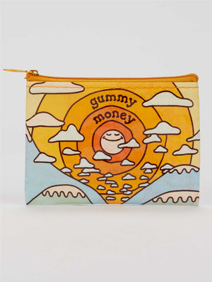 Introducing the Gummy Money Coin Purse by Blue Q—a compact, zippered pouch adorned with a cheerful retro sun, fluffy clouds, and "gummy money" playfully lettered on the front. Crafted from recycled material, this mellow accessory features a soothing palette of yellow, orange, and blue shades.