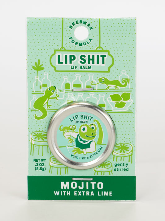 Blue Q’s Lip Shit Lip Balm-Mojito With Extra Lime comes in a green and white package featuring a cartoon frog bartender, lizards, and lab glassware illustrations.