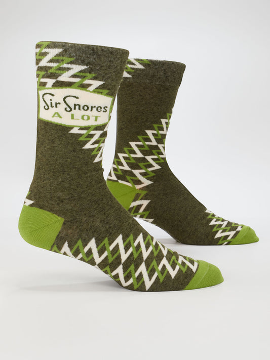Sir Snores A Lot M-Crew Socks by Blue Q: green men's socks with white zigzag pattern, light green heels and toes, soft combed cotton. Fits men’s shoe size 7-12. Label near top reads “Sir Snores A Lot.”.