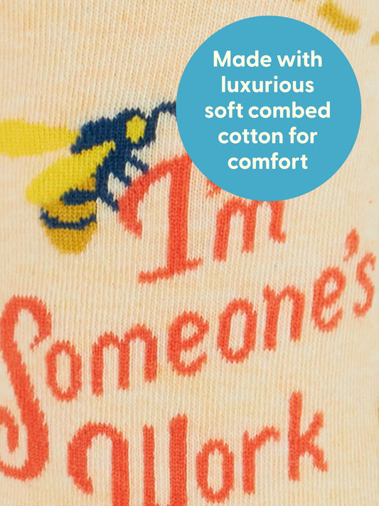 Close-up of Blue Q’s “I’m Someone’s Work Buddy” W-Crew Socks shows red text and a blue circle: “Made with luxurious soft combed cotton for comfort.” Yellow and blue patterns enhance these premium women's socks.