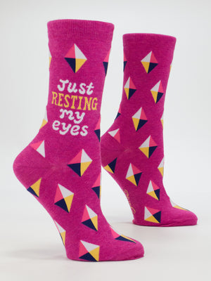 Blue Q Resting My Eyes W-Crew Socks: Bright pink combed cotton with colorful geometric diamonds and "Just RESTING my eyes" in yellow and white on the side. Fits women’s shoe sizes 5–10.