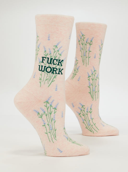 The Blue Q Fuck Work W-Crew Socks are women's light pink cotton socks with green and purple floral patterns and the bold phrase "FUCK WORK" on the side.