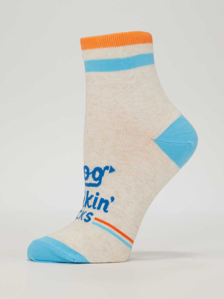 Blue Q's Dog Walkin' Ankle Socks in beige feature orange and blue stripes, a blue heel and toe, and fun accents. Shown on a foot model, these comfy socks for women are perfect for dog walking.