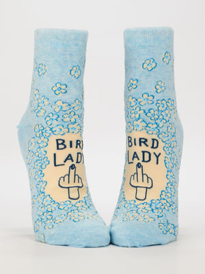 Bird Lady Ankle Socks by Blue Q: Women's light blue, shoe size 5-10, with small flowers, “BIRD LADY” text, and a hand showing a middle finger. Made from soft combed cotton for comfort.