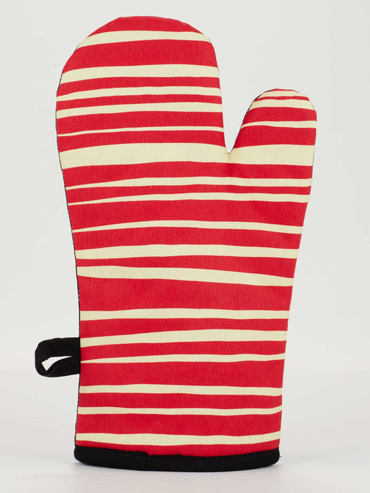 The Blue Q Meat Mitt Oven Mitt, made from 100% cotton with red and cream horizontal stripes plus a black hanging loop, stands upright against a plain white background.